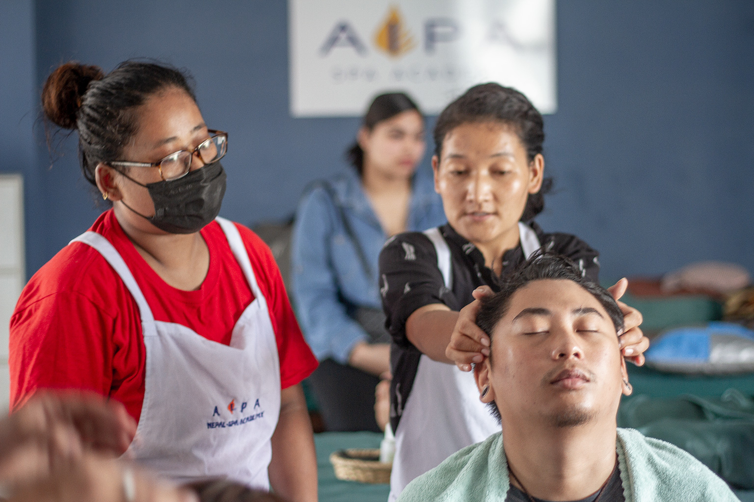 Student performing head massage - AIPA Nepal Spa Academy