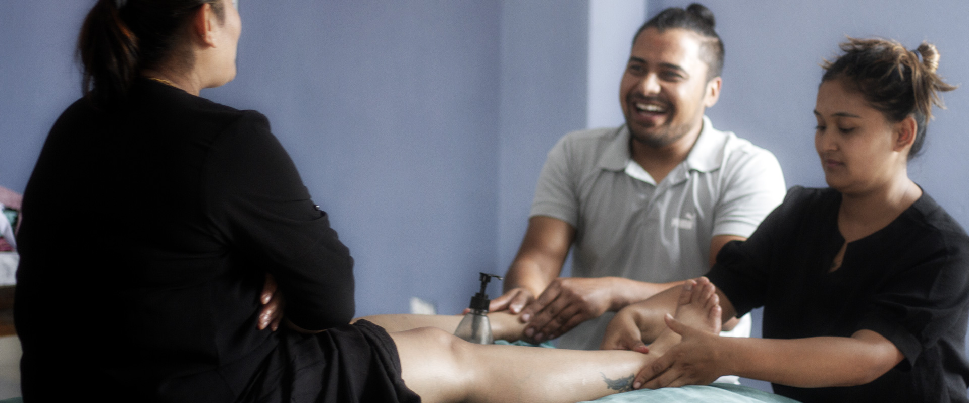 Students engaging in the basics of foot massage training at AIPA - Nepal Spa Academy AIPA - Nepal Spa Academy