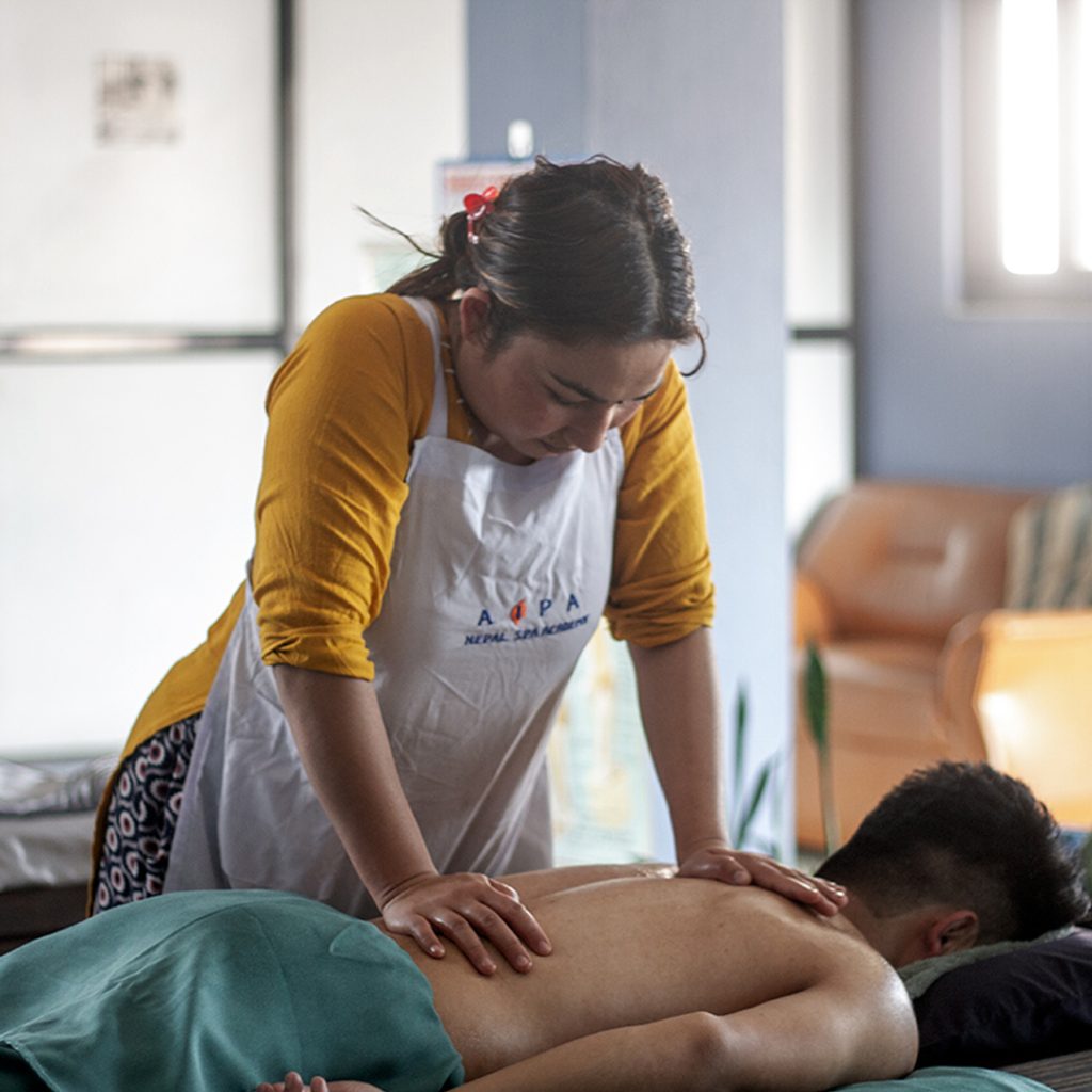 AIPA students applying "crossing" movement as part of the Swedish Body Massage training sessions